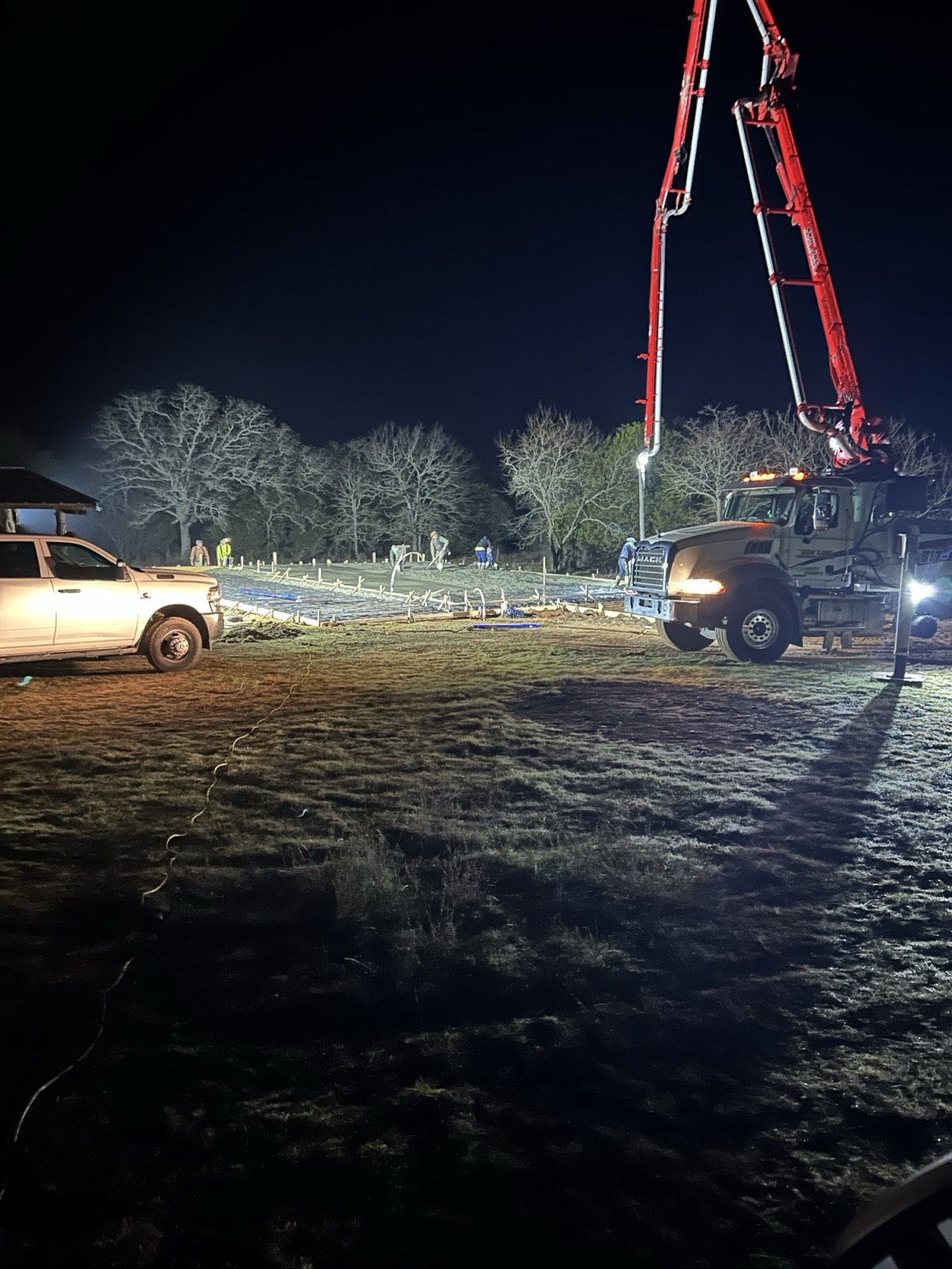 Concrete foundation pour at night for a residential build in North Texas